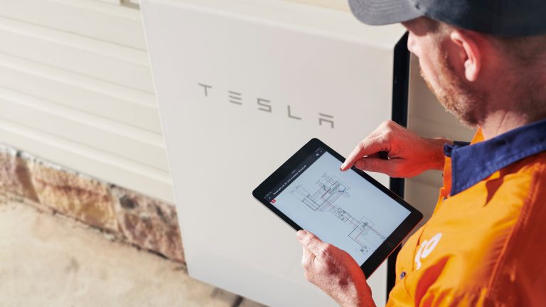 photo tall battery ipad tesla technician